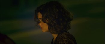 Movie still from “My Blueberry Nights” (2007), directed by Kar-Wai Wong – A person with long hair; Close Up shot, Over the shoulder angle