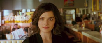 Movie still from “My Blueberry Nights” (2007), directed by Kar-Wai Wong – A person wearing a black shirt; Close Up shot, Over the shoulder angle