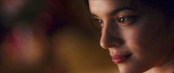 Movie still from “My Blueberry Nights” (2007), directed by Kar-Wai Wong – A woman's face in a dimly - lit room; Extreme Close Up shot, Low angle