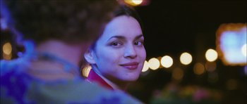 Movie still from “My Blueberry Nights” (2007), directed by Kar-Wai Wong – A woman's face in the dark; Close Up shot, Over the shoulder angle