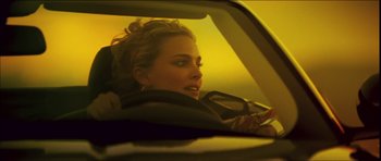 Movie still from “My Blueberry Nights” (2007), directed by Kar-Wai Wong – A woman sitting in the back seat of a car; Close Up shot, Over the shoulder angle