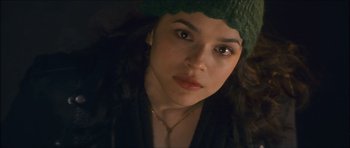 Movie still from “My Blueberry Nights” (2007), directed by Kar-Wai Wong – A person wearing a green hat; Close Up shot, Low angle