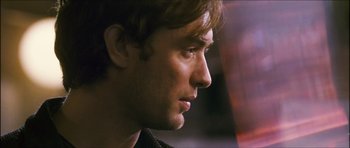 Movie still from “My Blueberry Nights” (2007), directed by Kar-Wai Wong – A young man's face; Close Up shot, Over the shoulder angle