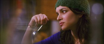 Movie still from “My Blueberry Nights” (2007), directed by Kar-Wai Wong – A woman holding a fork in her hand; Close Up shot, Over the shoulder angle