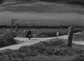 Movie still from “My Cousin Rachel” (1952), directed by Henry Koster – A black - and - white photo of people on a hill; Extreme Wide shot, High angle