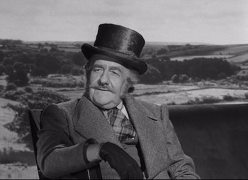Movie still from “My Cousin Rachel” (1952), directed by Henry Koster – An older man wearing a top hat and gloves; Medium shot, Low angle