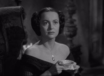 Movie still from “My Cousin Rachel” (1952), directed by Henry Koster – A black and white photo of a woman holding a cup of coffee; Close Up shot, Over the shoulder angle