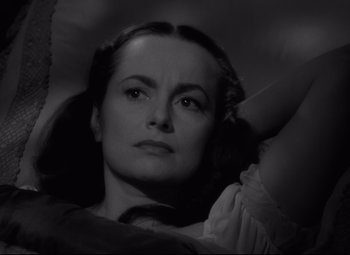 Movie still from “My Cousin Rachel” (1952), directed by Henry Koster – A black - and - white photo of a woman looking at the camera; Close Up shot, High angle
