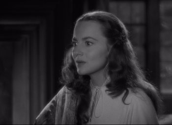 Movie still from “My Cousin Rachel” (1952), directed by Henry Koster – A black - and - white photo of a young woman; Close Up shot, Over the shoulder angle