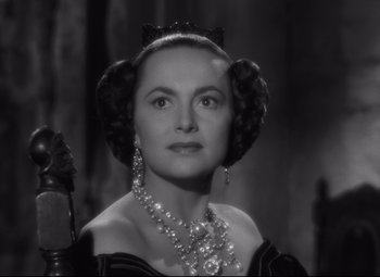 Movie still from “My Cousin Rachel” (1952), directed by Henry Koster – An old photo of a woman in a black and white photo; Close Up shot, Over the shoulder angle
