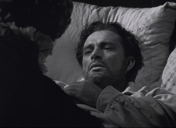 Movie still from “My Cousin Rachel” (1952), directed by Henry Koster – A man laying in a bed with his eyes closed; Close Up shot, Overhead angle