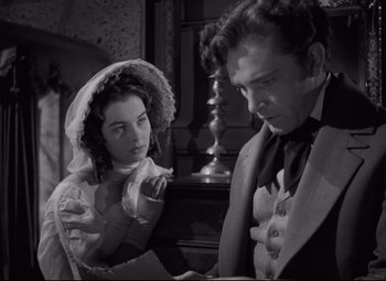 Movie still from “My Cousin Rachel” (1952), directed by Henry Koster – A man and a woman are looking at each other; Medium shot, Over the shoulder angle