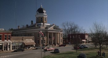 Movie still from “My Cousin Vinny” (1992), directed by Jonathan Lynn – A large building with a clock on the top of it; Extreme Wide shot, High angle