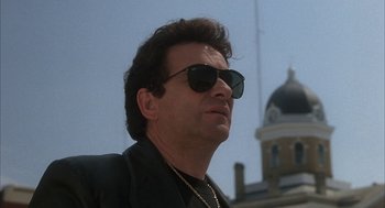 Movie still from “My Cousin Vinny” (1992), directed by Jonathan Lynn – A person wearing sunglasses; Close Up shot, Low angle