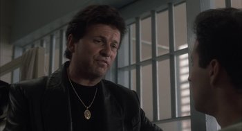 Movie still from “My Cousin Vinny” (1992), directed by Jonathan Lynn – A person wearing a necklace; Close Up shot, Low angle