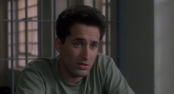 Movie still from “My Cousin Vinny” (1992), directed by Jonathan Lynn – A person sitting in front of a window; Close Up shot, High angle