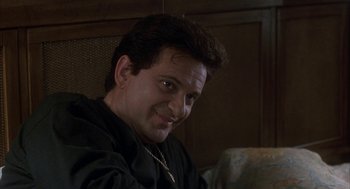 Movie still from “My Cousin Vinny” (1992), directed by Jonathan Lynn – A person sitting in a chair; Close Up shot, Low angle
