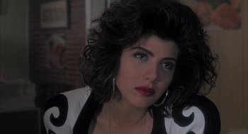 Movie still from “My Cousin Vinny” (1992), directed by Jonathan Lynn – A person wearing a black and white shirt; Close Up shot, Over the shoulder angle