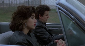 Movie still from “My Cousin Vinny” (1992), directed by Jonathan Lynn – A man and a woman sitting in the back of a car; Close Up shot, Over the shoulder angle