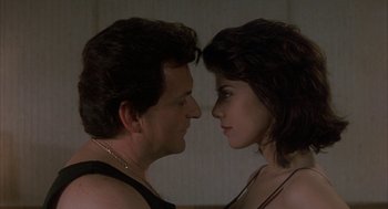 Movie still from “My Cousin Vinny” (1992), directed by Jonathan Lynn – A man and a woman face to face in front of a mirror; Close Up shot, Low angle