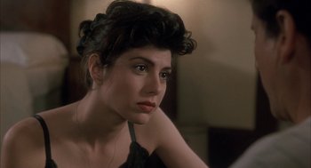 Movie still from “My Cousin Vinny” (1992), directed by Jonathan Lynn – A woman sitting in front of a mirror looking at the camera; Close Up shot, Over the shoulder angle