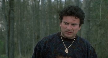 Movie still from “My Cousin Vinny” (1992), directed by Jonathan Lynn – A person wearing a necklace; Close Up shot, Over the shoulder angle