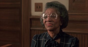 Movie still from “My Cousin Vinny” (1992), directed by Jonathan Lynn – An older woman wearing glasses and a checkered shirt; Close Up shot, Low angle