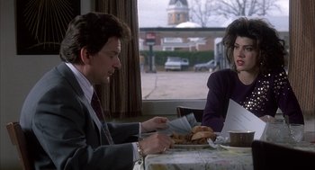 Movie still from “My Cousin Vinny” (1992), directed by Jonathan Lynn – A man and a woman sitting at a dinner table; Medium shot, Over the shoulder angle
