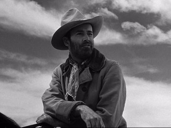 Movie still from “My Darling Clementine” (1946), directed by John Ford – Black and white photograph of a man wearing a cowboy hat; Close Up shot, Low angle