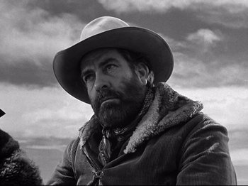 Movie still from “My Darling Clementine” (1946), directed by John Ford – Black and white photograph of a man in a cowboy hat; Close Up shot, Low angle