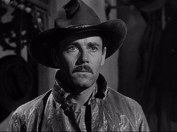 Movie still from “My Darling Clementine” (1946), directed by John Ford – A black and white photo of a man wearing a hat; Close Up shot, Low angle