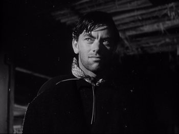 Movie still from “My Darling Clementine” (1946), directed by John Ford – Black and white photograph of a man wearing a jacket; Close Up shot, Low angle