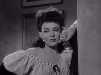 Movie still from “My Darling Clementine” (1946), directed by John Ford – A black - and - white photo of a woman in a dress; Close Up shot, Low angle