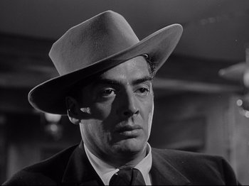 Movie still from “My Darling Clementine” (1946), directed by John Ford – A black and white photo of a man wearing a hat; Close Up shot, Low angle