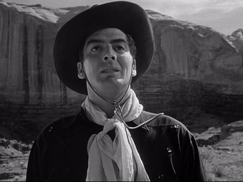 Movie still from “My Darling Clementine” (1946), directed by John Ford – A man wearing a cowboy hat and a neck tie; Close Up shot, Low angle