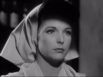 Movie still from “My Darling Clementine” (1946), directed by John Ford – A black and white photo of a woman wearing a head scarf; Close Up shot, Low angle