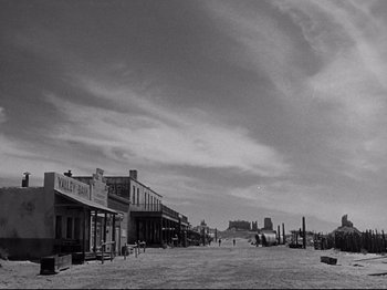 Movie still from “My Darling Clementine” (1946), directed by John Ford – An old photo of an empty street in the desert; Extreme Wide shot, Low angle