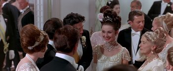 Movie still from “My Fair Lady” (1964), directed by George Cukor – A group of people standing next to each other in a room; Close Up shot, Over the shoulder angle