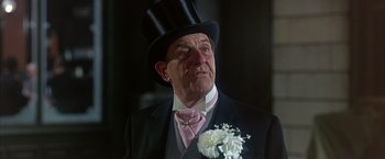 Movie still from “My Fair Lady” (1964), directed by George Cukor – An older man wearing a top hat and a suit; Close Up shot, Low angle