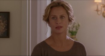 Movie still from “My Father the Hero” (1994), directed by Steve Miner – A person wearing a brown shirt; Close Up shot, Over the shoulder angle