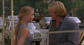 Movie still from “My Father the Hero” (1994), directed by Steve Miner – A man and a woman standing next to each other on the street; Medium shot, Over the shoulder angle