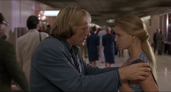 Movie still from “My Father the Hero” (1994), directed by Steve Miner – A man and a woman looking at one another; Medium shot, Low angle