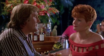 Movie still from “My Father the Hero” (1994), directed by Steve Miner – A man and a woman sitting at a bar talking; Medium shot, Over the shoulder angle