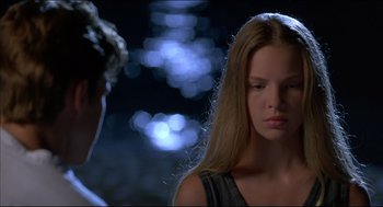 Movie still from “My Father the Hero” (1994), directed by Steve Miner – A young woman standing in front of a man; Close Up shot, Over the shoulder angle