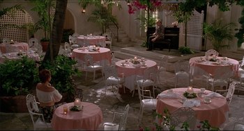 Movie still from “My Father the Hero” (1994), directed by Steve Miner – Tables and chairs set up for a wedding reception; Extreme Wide shot, High angle