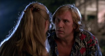 Movie still from “My Father the Hero” (1994), directed by Steve Miner – A man and a woman are looking at each other; Close Up shot, Over the shoulder angle