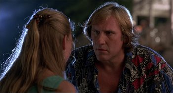 Movie still from “My Father the Hero” (1994), directed by Steve Miner – A man and a woman are looking at each other; Close Up shot, Over the shoulder angle