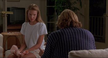 Movie still from “My Father the Hero” (1994), directed by Steve Miner – A young girl sitting next to an older woman; Medium shot, Over the shoulder angle