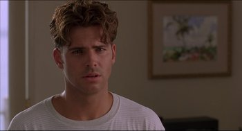 Movie still from “My Father the Hero” (1994), directed by Steve Miner – A person wearing a white t - shirt; Close Up shot, Over the shoulder angle