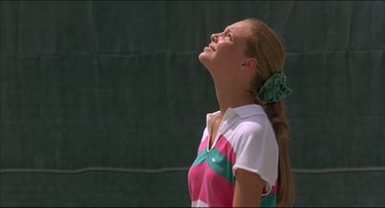Movie still from “My Father the Hero” (1994), directed by Steve Miner – A woman with a ponytail looking up into the sky; Close Up shot, Low angle